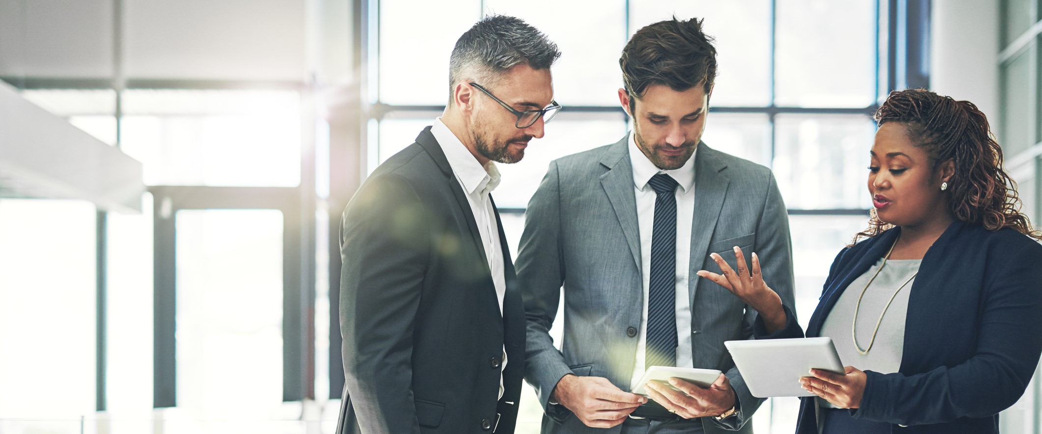 Staff talking with business partner at a meeting